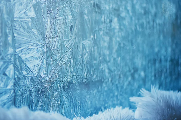 The frost on the window in cold tones. background