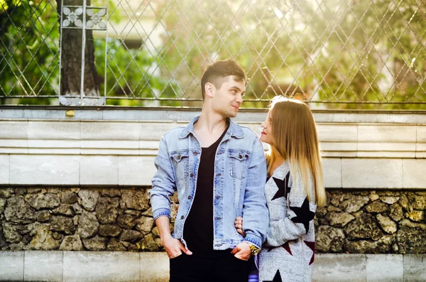 Cute couple on a date in the park on a sunny day