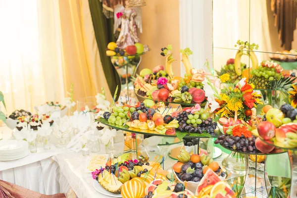 Various sweet sliced fruit on a buffet table