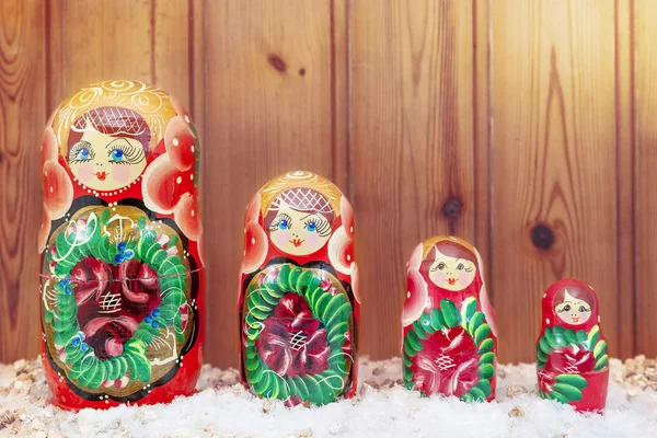 Set of matryoshka covered by christmas hat warm look filtered