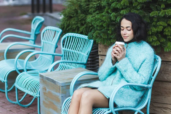 Woman enjoying warming drink