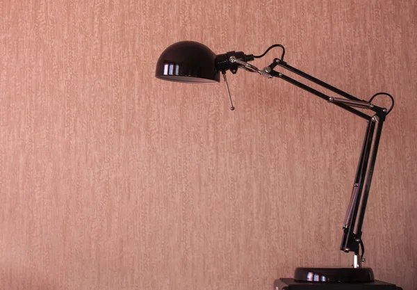 Desk lamp on the background wall