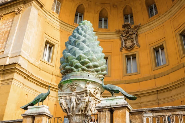 Fragment of an ancient bronze Roman fountain in the form of the pine cone (Fontana della Pigna ) in internal garden yard of Vatican, Rome, Italy.