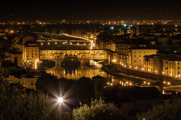 Night view of famous bridge Ponte Vecchio over Arno river in Florence, Toscana province, Italy.