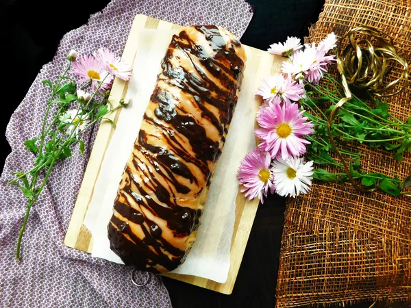 Baked products covered with a chocolate icing