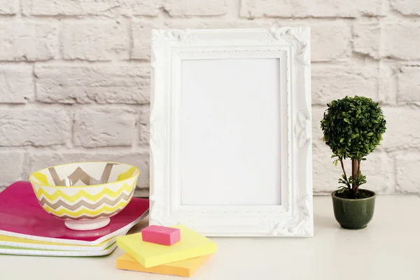 Frame Mock up. White Frame mockup. Styled Stock Photography. Notebooks, Bonsai Plant. Template Product Mock-up. Empty Frame on Brick Wall. White Vertical Frame on Gray Wall, Office Desk Accessories