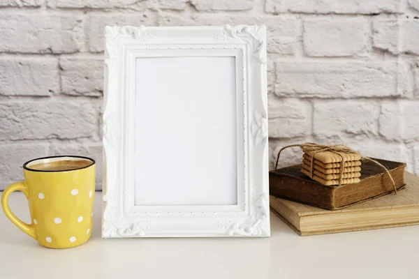 Frame Mockup. White Frame Mock Up. Yellow Cup Of Coffee With White Dots, Cappuccino, Latte, Old Books, Cookies. Display Mock-Up, Styled Stock Photography . Empty Rustic Frame. Gray Brick Wall. Leisure