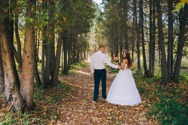 Young couple in autumn forest