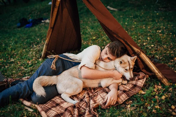 Boy lying with dog