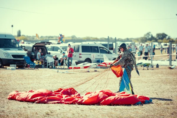 Parachute jumper on a wing parachute execute a controlled desce