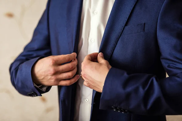 Businessman wears a jacket.Politician, man\'s style,male hands closeup, American, European businessman, business, fashion and clothing concept