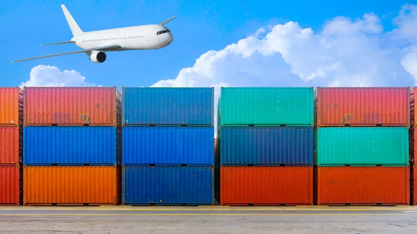 Business and logistics. Cargo transportation and storage. Equipment containers with air plane and blue sky.