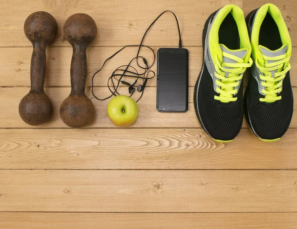 Sports accessories for fitness on the wooden floor.