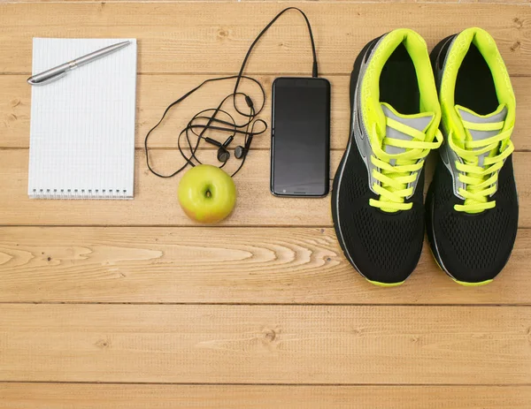 Sports accessories for fitness on the wooden floor.