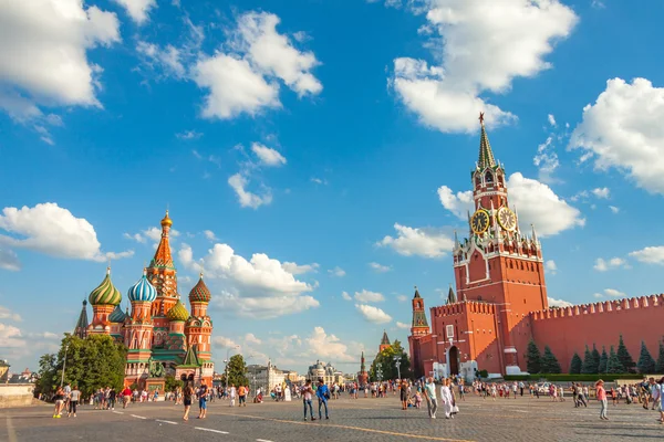 Red square in the summer, view of the Spasskaya tower and Basil the Blessed Cathedral, the most famous landmark in Russia