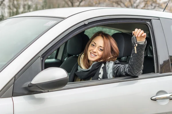 Girl showing new car keys