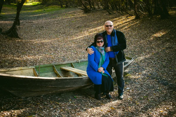 Adult couple walking in autumn park