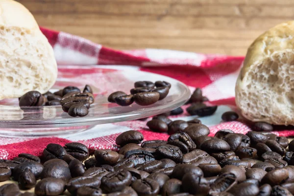 Coffee and bread wooden background