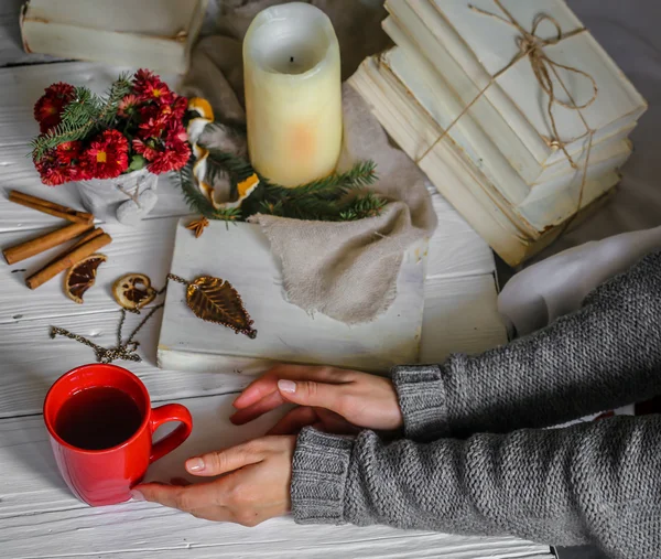 Warm and cozy,  concept girl hands with a Cup of tea