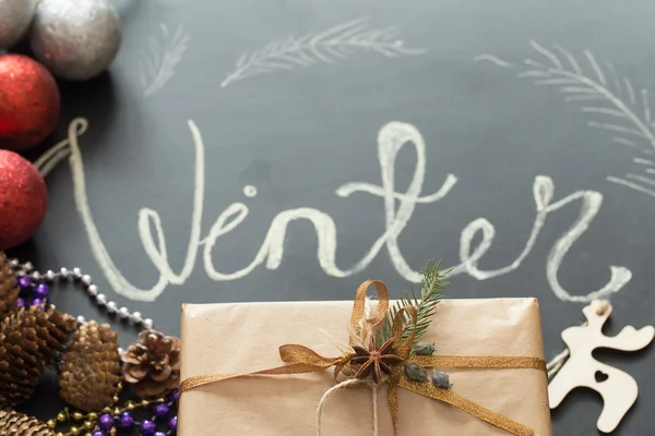 Chalk inscription winter on black Board holidays