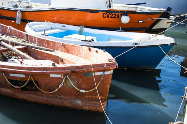 Group of small Italian fishing boats; working row-boats with fishing paraphernalia