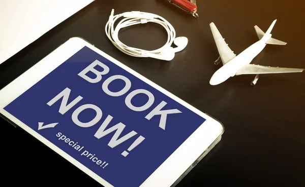 Book your hotel online using your Tablet or mobile devices now. Travel agency website on tablet. Online accommodation booking website on tablet screen.