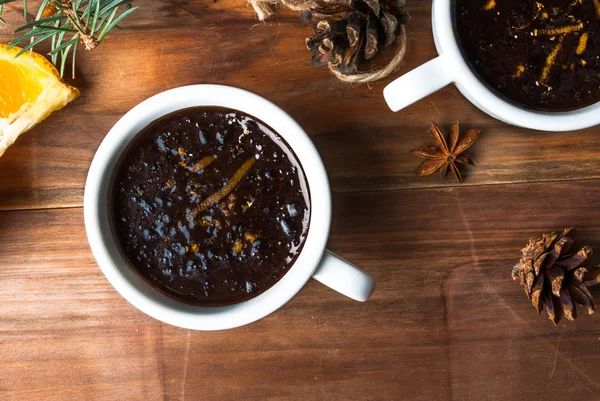 Hot chocolate with spices, orange and orange zest