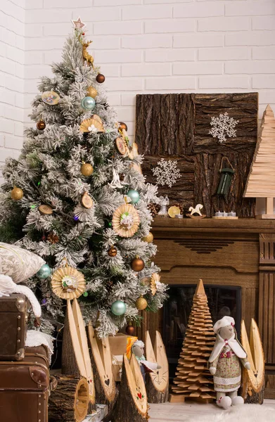 Christmas tree with holiday decorations. Christmas decorations. Holiday interior. Rustic style
