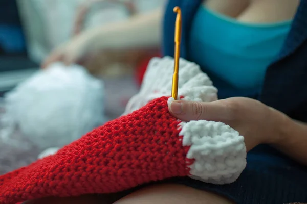 The process of crochet hats Santa Claus