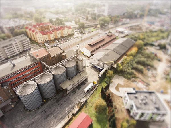 Aerial view of the old factory near city center, Krakow, Poland. Tilt-shift effect.