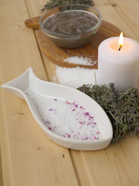 Salt,mud,candle and dry lavender on the wooden background