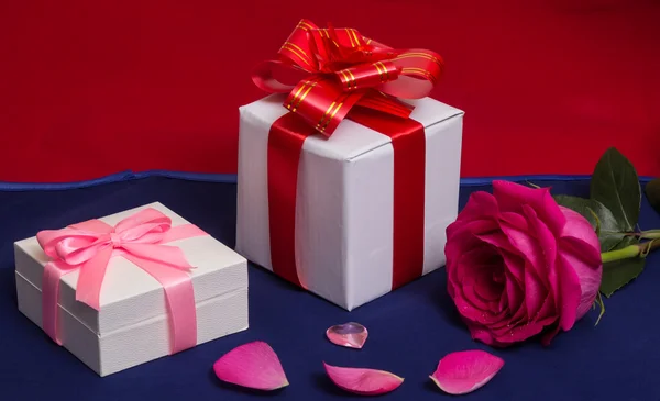 White gift boxes with red rose and heart