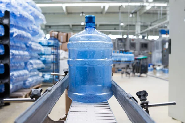 Robotic factory line bottling water into gallons