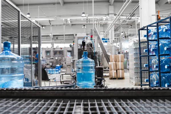 Robotic factory line bottling water into gallons