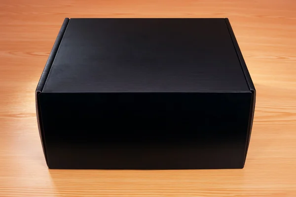 Mysterious black box on wood background