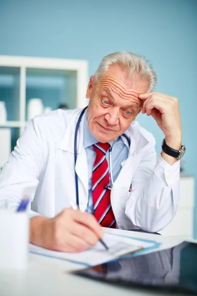 Sad and surprised doctor at work