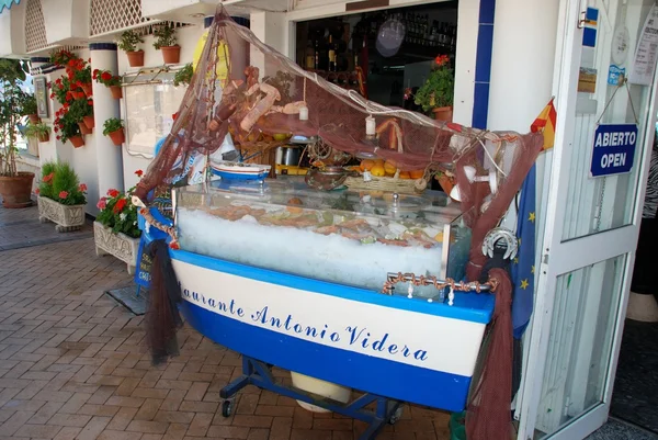 Fish display cabinet outside a beach bar (Chiringuito), Fuengirola, Spain.