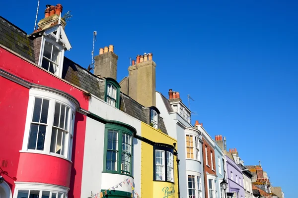 Brightly painted buildings alongside the harbour, Weymouth.