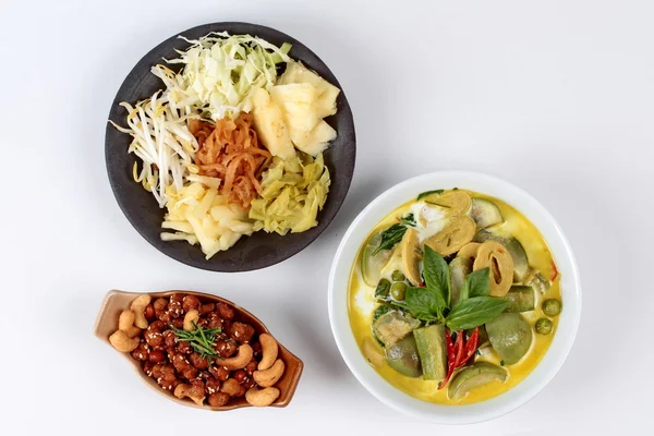 Mixed vegetables and spicy fried textured soy protein curry served with side disk as bean sprouts,cabbage,sweet radish and pickle