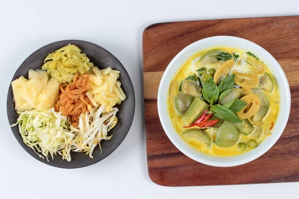 Green fermented flour curry  with  mixed herb ,green fermented flour curry  with  mixed vegetable served side disk.