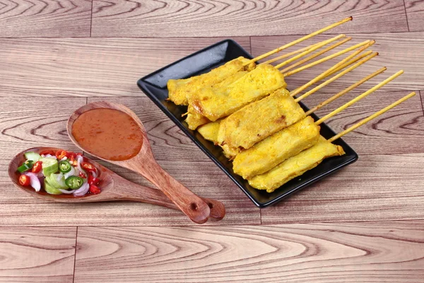 Pork satay served with Thai cucumber chili sauce and nut sauce are home made in big size.