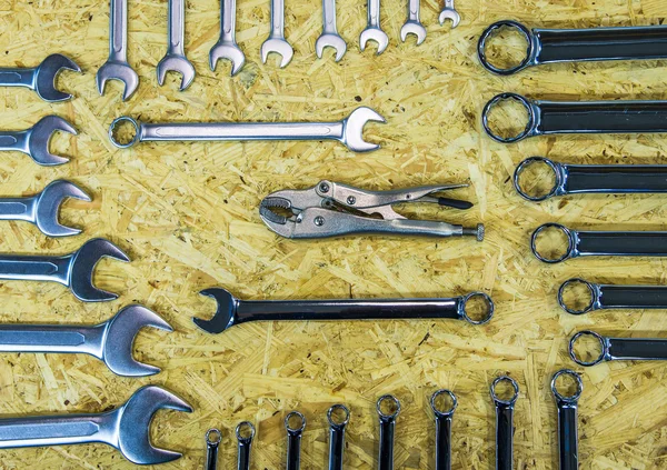 Tools in tool belt on wood planks