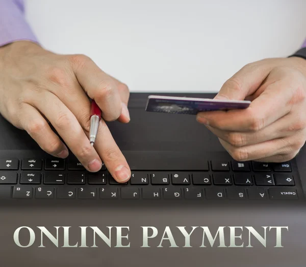 ONLINE PAYMENT, Business Man Payment Online by Credit Card and Lapto.  Image for Solution of Mobile banking Shopping or Mobile Payment Application online concept.