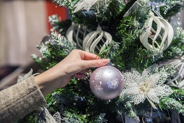 Woman decorating Christmas tree, Decorating Christmas tree. Picture of woman decorating christmas tree