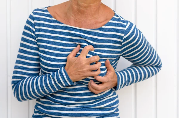 Woman suffering severe chest pains