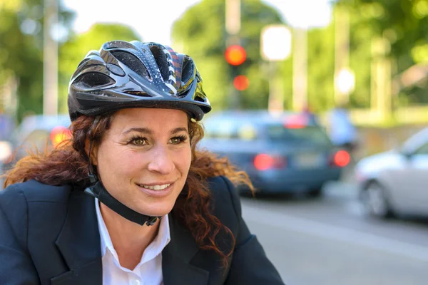 Attractive businesswoman commuting on a bicycle