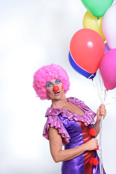 Funny Female Clown Holding Colorful Balloons