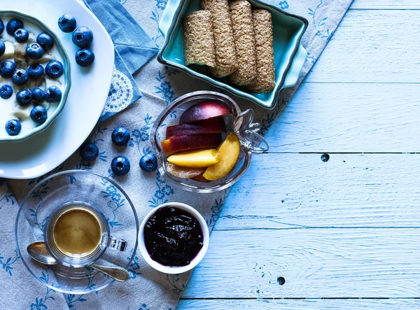 Healthy Breakfast with blueberries and banana yogurt