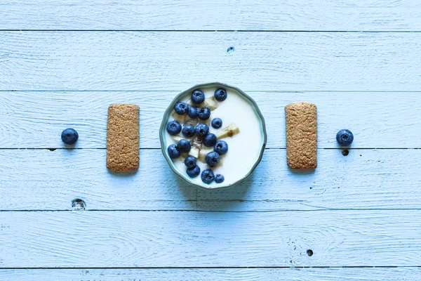 Healthy Breakfast with blueberries and banana yogurt