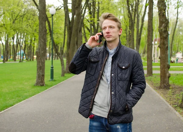 Young man using his telephone